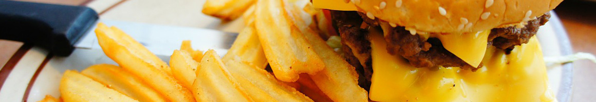Eating Burger Fast Food at Hunger Burger restaurant in Philadelphia, PA.